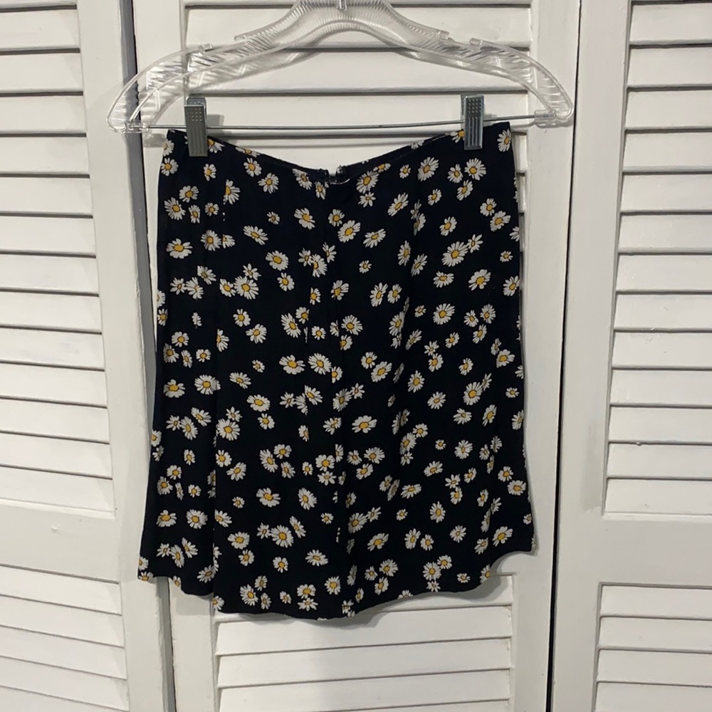 Light weight floral skirt with zip up back. Never worn tags still attached.